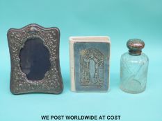 A hallmarked silver photograph frame, height 18cm, a hallmarked silver mounted leather bible,