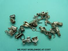 A silver charm bracelet with eight additional charms