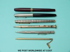 A collection of vintage pens and pencils including Parker, Sheaffer, Eversharp etc,