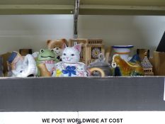 A collection of novelty teapots, cups,