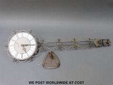 Schatz Elexacta swinging clock with bracket plus another similar example