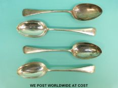 A set of four early 20thC hallmarked silver Old English pattern table spoons, two Sheffield 1905,