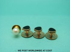 Three 9ct gold studs set with oynx (3.5g) and a pearl stud.