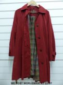 A ladies Mulberry coat in red,