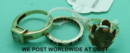 A 9ct gold ring set with topaz and diamonds,