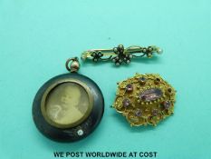 A Victorian yellow metal brooch set with pink stones,