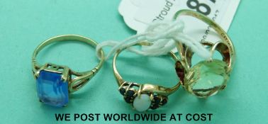 Three various 9ct gold rings, two set with paste and one set with an opal and sapphires (6.