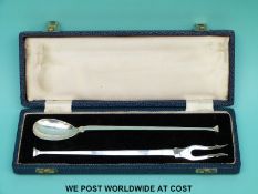 A cased pickle set comprising fork and spoon,