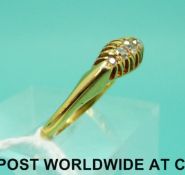 An 18ct gold ring set with five diamonds (size N)