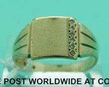 A 9ct gold signet ring set with a row of diamonds (4.