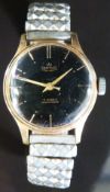 Smith De Luxe gentleman's wristwatch with gold hands and baton markers and black face,