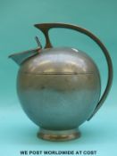 A Malayan pewter jug in the Arts and Crafts style,
