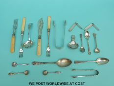 A quantity of hallmarked silver cutlery to include two pairs of sugar tongs and three various