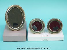 A pair of Concorde hallmarked silver circular photo frames, diameter 6.