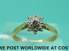 An 18ct gold ring set with diamonds in a cluster (size M)