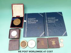 A cased 1902 Coronation medal, 1911 bronze medal in Spink box,