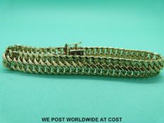A 9ct gold bracelet of plaited design (10.