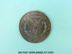 An 1883 Morgan USA Dollar F-VF