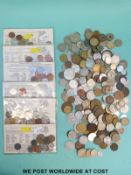 A tin containing a collection of world coinage 19th century onwards,