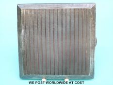 A hallmarked silver Art Deco style cigarette case with gold band decoration (113g all in)