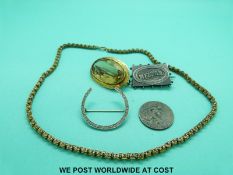 A yellow metal necklace marked 9ct gold (12.