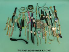 Over 50 various ladies and gentleman's wristwatches including Accurist, Swatch etc.