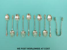 A set of nine Victorian hallmarked silver apostle spoons and matching tongs,