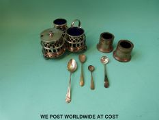 A plated three piece cruet set on stand and further similar cruets