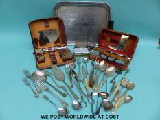 A quantity of silver plate to include Art Deco tray, brush sets,