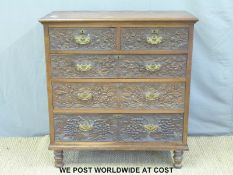 A 19th century carved oak chest of two over three graduated drawers raised on turned legs (W98 x