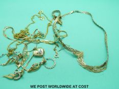 A 9ct gold heart locket with an enamel butterfly to the front, a tri-coloured 9ct gold necklace,