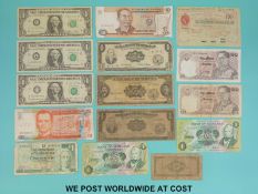 A collection of various world bank notes to includes USA, Scotland, Philippines etc.