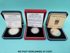 Three cased overseas commemorative silver coins to include a Tuvalu Duke of Edinburgh award crown