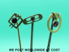 Two Edwardian yellow metal stick pins marked 15ct gold,