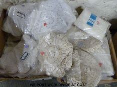 Four boxes containing a large quantity of table runners and similar covers etc.