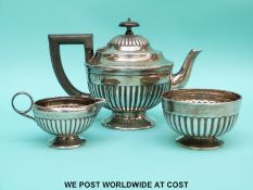 A Victorian Mappin & Webb hallmarked silver bachelor's tea set with reeded decoration,
