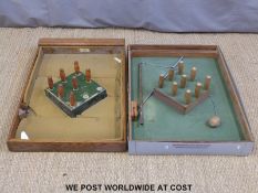 Two bar skittles games, one named G.