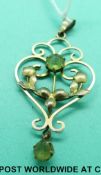 An Edwardian yellow metal pendant marked 9ct gold set with peridot