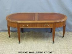 A leather inset single drawer coffee table (length 111cm)