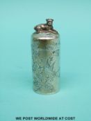 A Victorian hallmarked silver scent bottle with engraved floral decoration and seated dog finial,