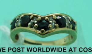 A 9ct gold ring set with sapphires and diamonds (size L)