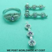A suite of 18ct white gold jewellery comprising pendant,