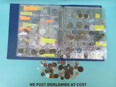 An amateur collection of overseas coinage in folder and tin, including silver content,