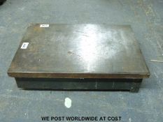 A cast iron surface plate approximately 2ft x 1ft