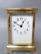 French 20th century brass cased carriage clock, Arabic numerals on white enamelled dial, 11.