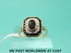 A 9ct gold ring set with sapphires and diamonds in an Art Deco style (size P)