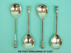 Four Garrard seal topped feature hallmarked silver spoons, two London 1965 and 1964,