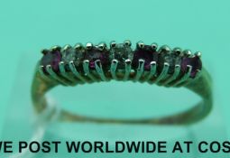 A 9ct gold ring set with clear stones and rubies (size Q)