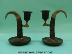 A pair of horn candlesticks