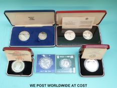 Mixed cased silver and silver proof coins including Churchill, Sierra Leone Islands, rupee set,